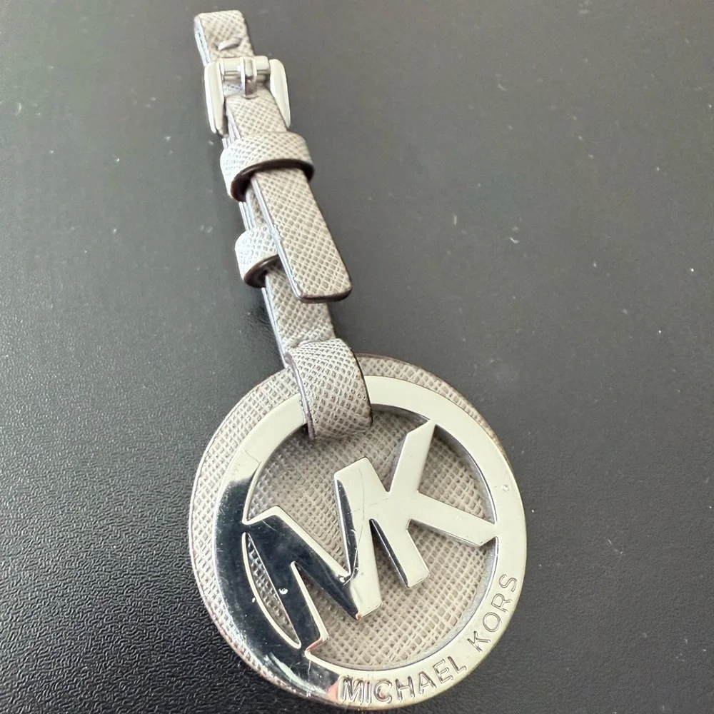 Michael Kors Silver MK Circle Logo Tag with Taupe Textured Strap